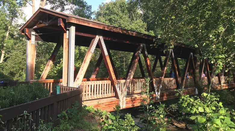 The covered bridge forms the entrance to the Vickery Creek Trail near Oxbo Road.