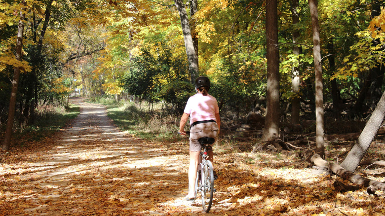 Cyclist riding bike on Des Plaines River Trail in Illinois near Deerfield and outside Chicago