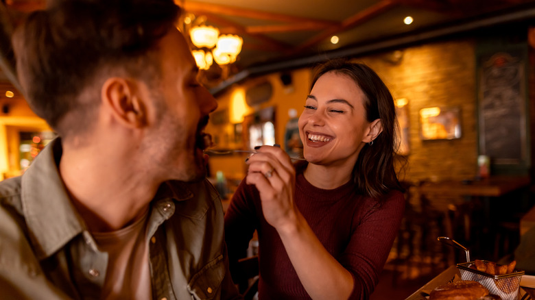 Couple eating food at a restaurant