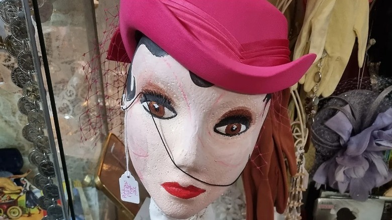 A pink vintage hat and antique items on display at The Regent in Blackpool, England