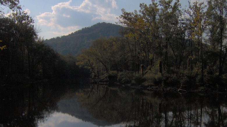 Ballard Lake in Indian Mountain State Park, Tennessee, with trees and mountains reflected on its surface