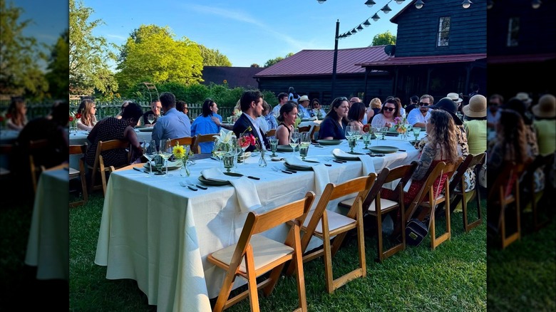 Outdoor community dining event in Serenbe