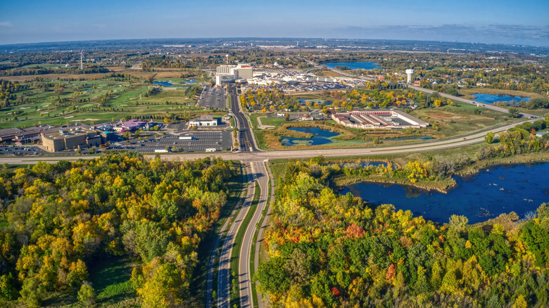 Aerial view of the grounds of Mystic Lake Casino Hotel, surrounded by scattered water and greenery.