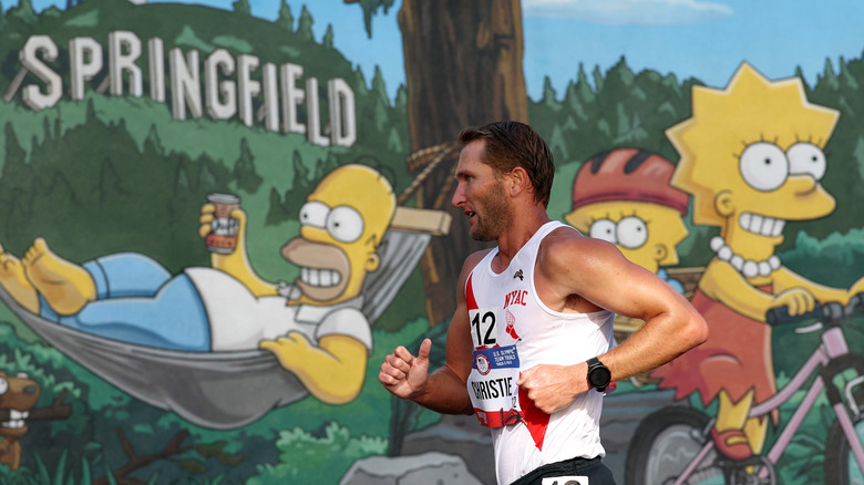 Racewalk Final runner sprints by the Simpsons mural