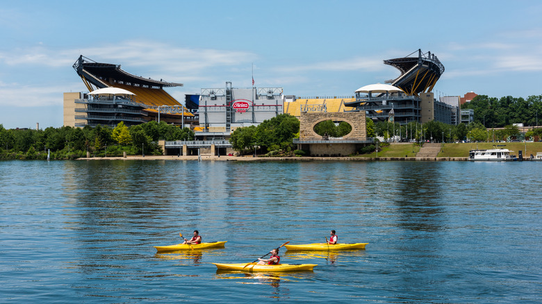 Kayakers on the Allegheny River, facing the former Heinz Field Stadium in Pittsburgh