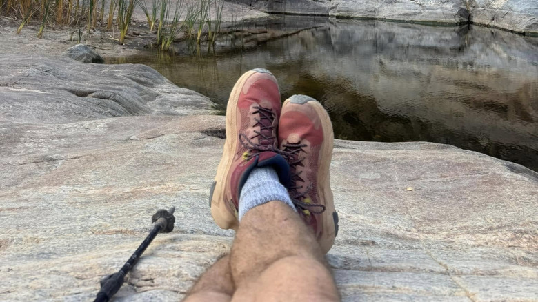 A hiker's boots with water pools at Seven Falls in Tucson, Arizona