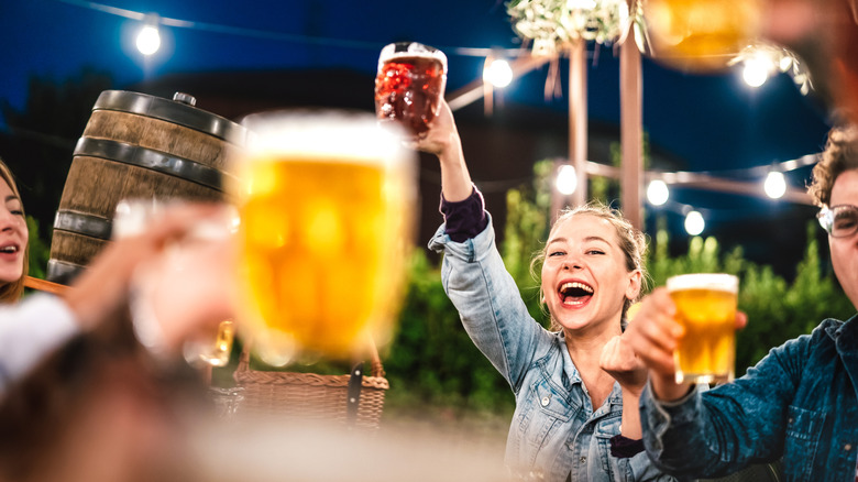 People cheering at a brewery