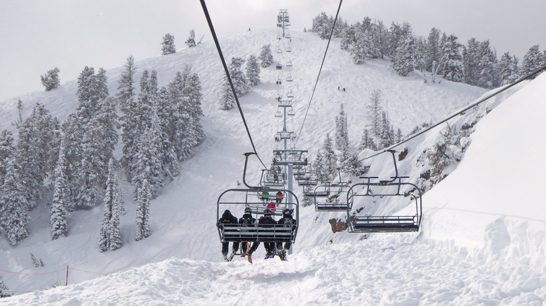 Chairlift carries skiers up Powder Mountain Ski Resort in Utah