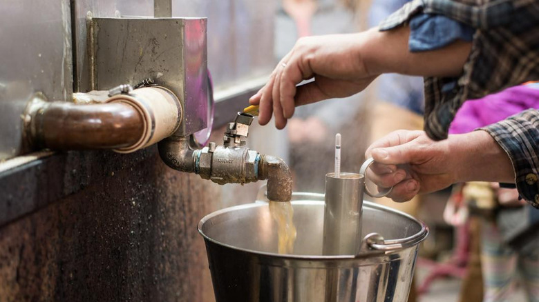 Maple syrup being produced at a sugar house in Colchester, Vermont