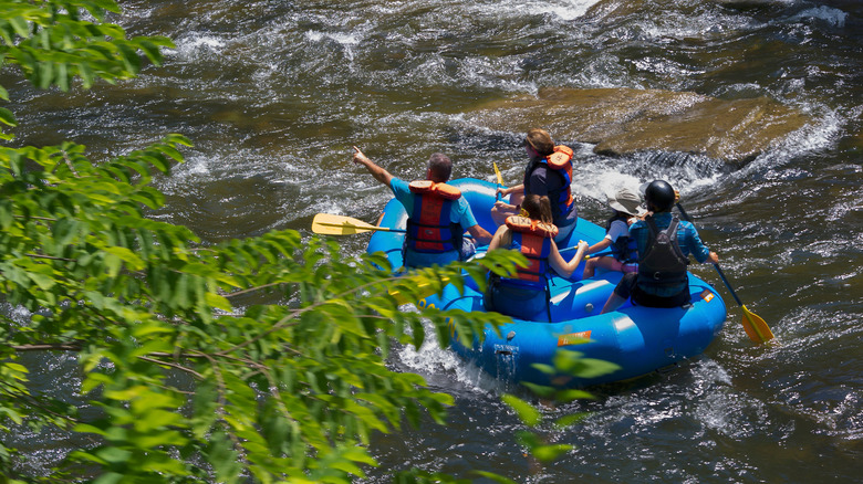 A group of people whitewater rafting on the Nantahala River