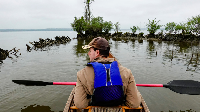 Paddler visiting a Mallows Bay Ghost Fleet shipwreck