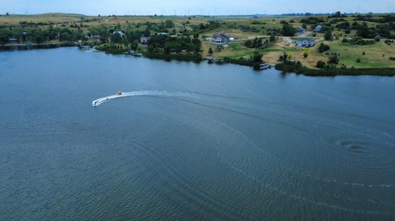 An aerial view of boaters out on Lake Ashtabula and large homes along the lake's shore