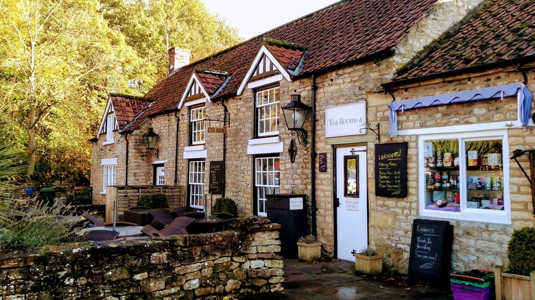 Idyllic medieval stone shopfronts await customers