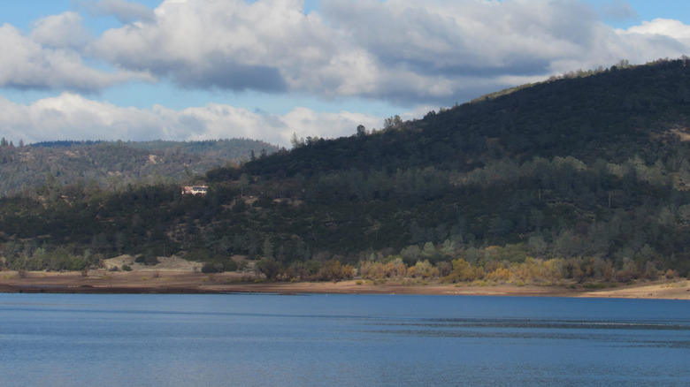 Collins Lake in Northern California with forested hills in the background