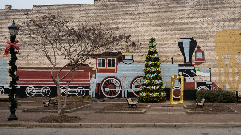 Christmas and holiday-themed mural on a brick building in Clover, South Carolina.