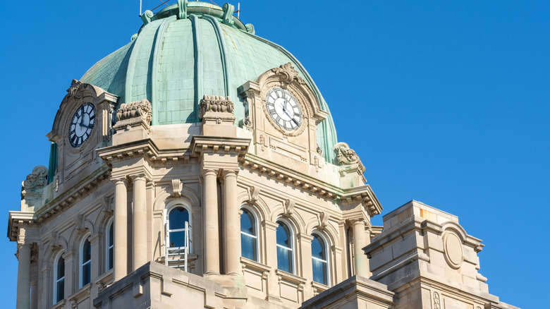 Close up of Kankakee County Courthouse dome against clear blue sky.