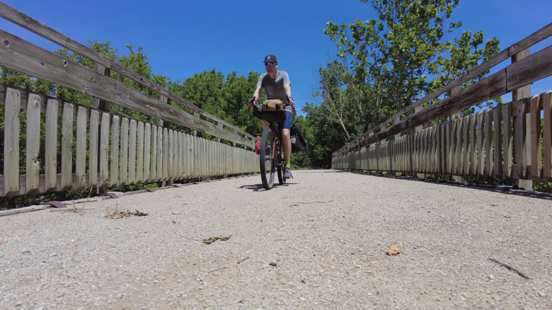 Cyclist on a bridge on the Prairie Spirit Trail State Park in Kansas