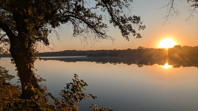 The lake at Crawford State Park, Kansas, during sunset, with the view mirroring in the water