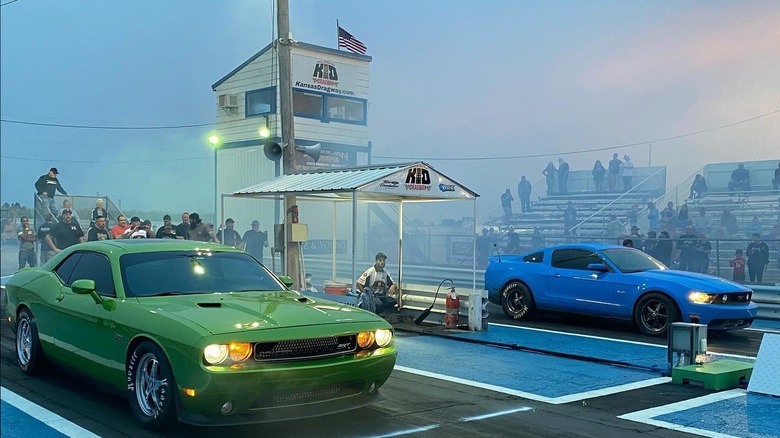 Two cars with headlights on at the Kansas Dragway
