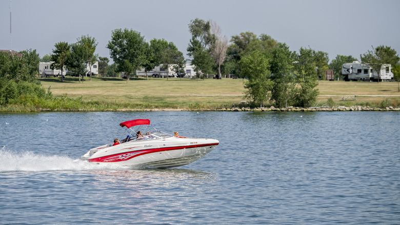 Boat driving along the Waconda Lake by the campground