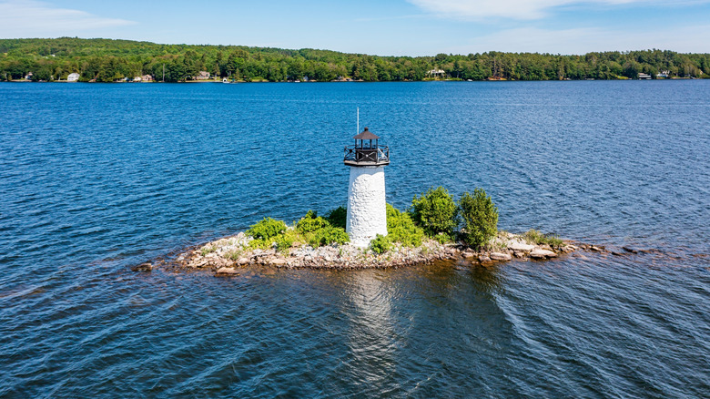 The ladies delight lighthouse surrounded by the Cobbosseecontee Lake in Kennebec County, Maine