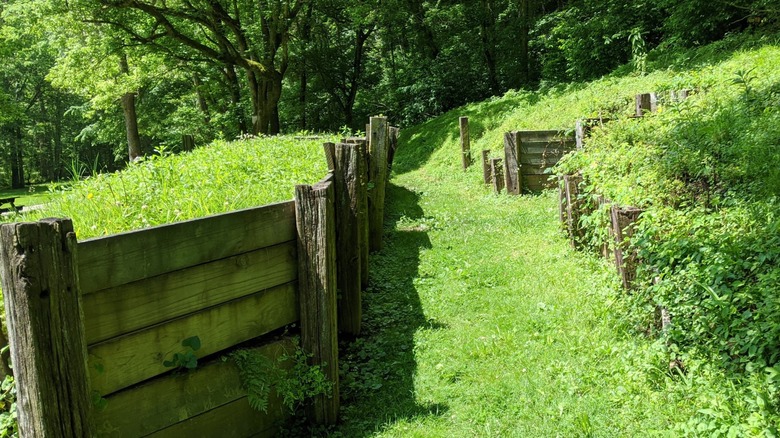 Reconstructed wooden fences line the earthworks at Fort Duffield