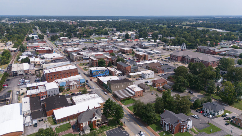 Aerial drone shot of Madisonville's downtown historic buildings and surrounding parks.