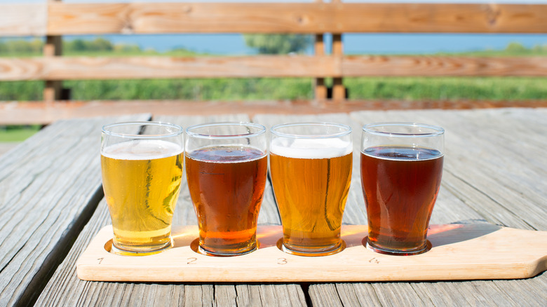 four glasses of beer on a table