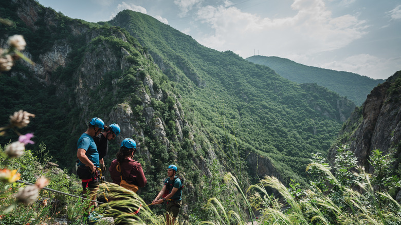 Travelers navigate a via ferrata in the Sharr mountains above Prizren, Kosovo