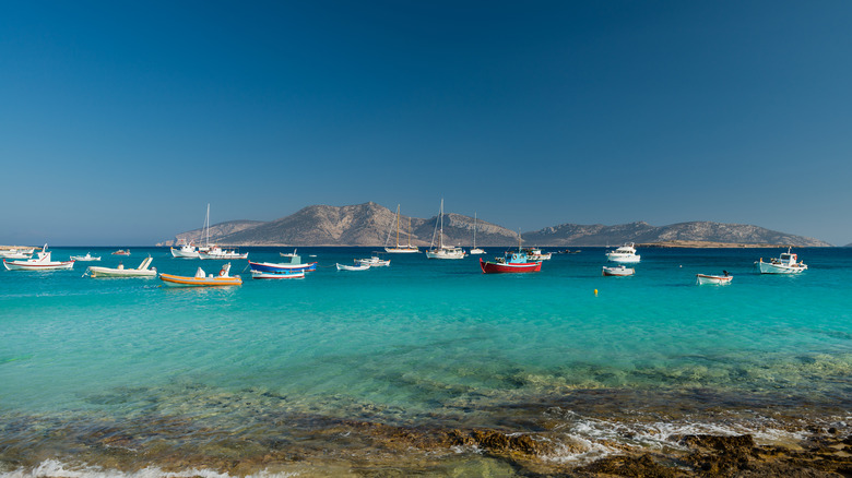 Colorful boats in Ammos Bay on Ano Koufonisi