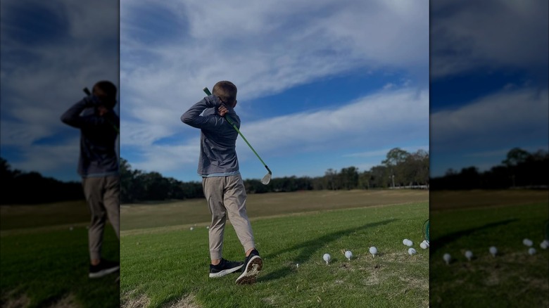 A child swinging their golf club at Harbor Hills Country Club's course, Lady Lake, Florida