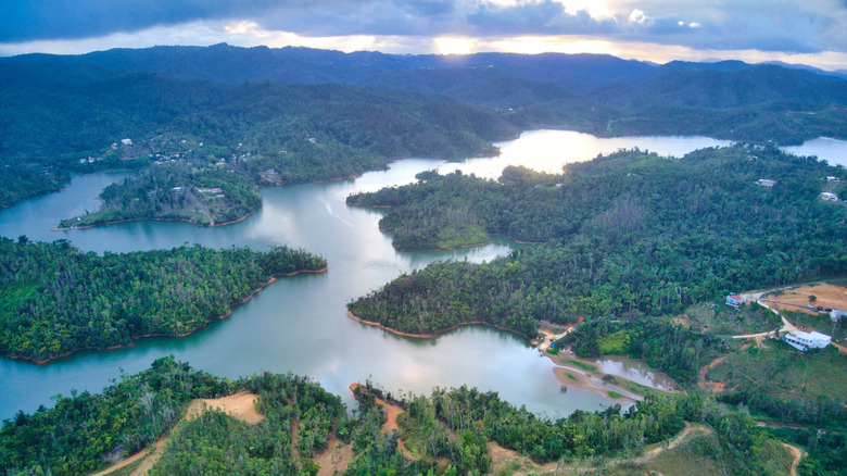 Lago Carite among the forested hills of Carite State Park in Puerto Rico