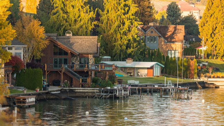 Vacation homes with private jetties and towering trees on the shore of Lake Chelan, Washington