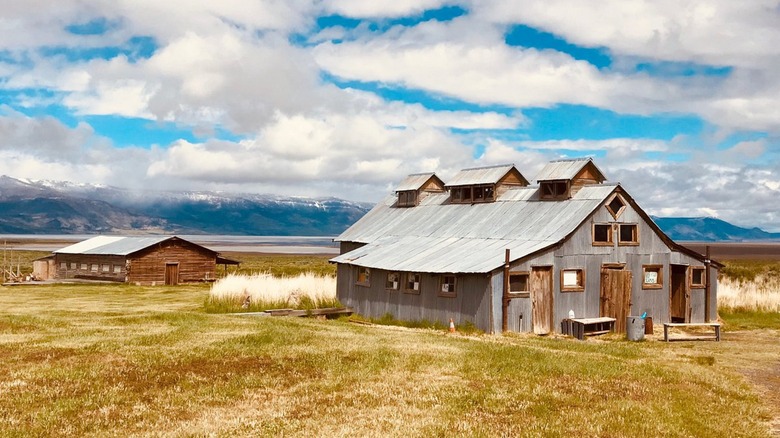 Rustic buildings under dramatic skies at Summer Lake Hot Springs in the Oregon Outback