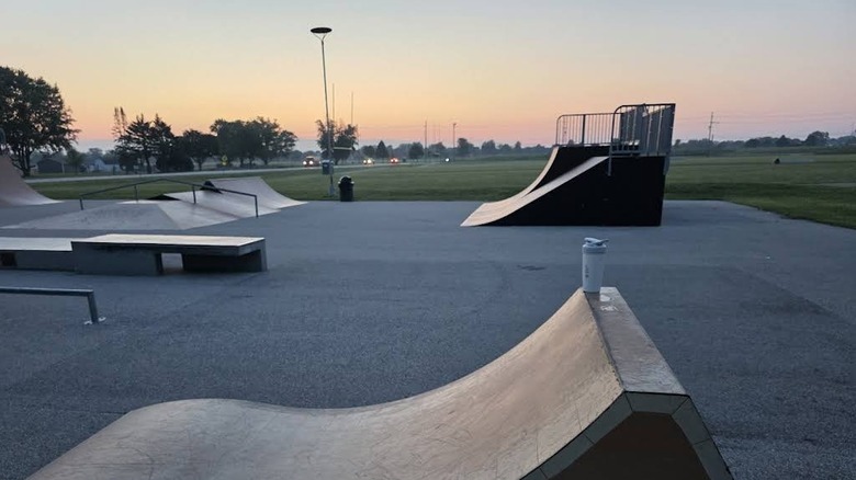 A skate park filled with ramps at dusk in Lake in the Hills, Illinois