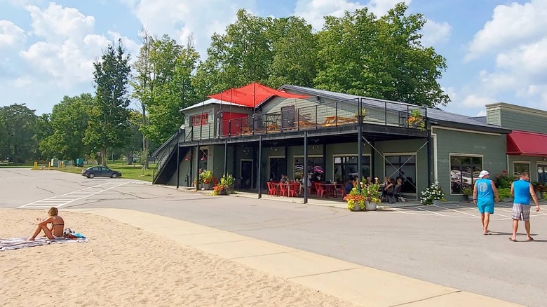 A view of Buddy's on the Beach, showing the restaurant with the beach in the foreground