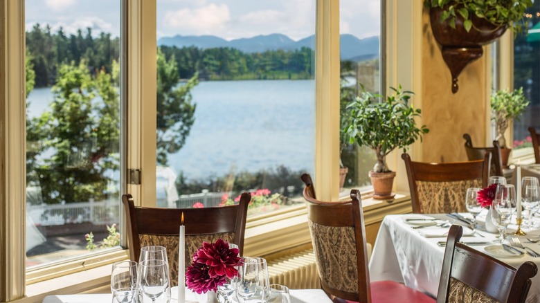 View of tables at The View restaurant overlooking lake and mountains