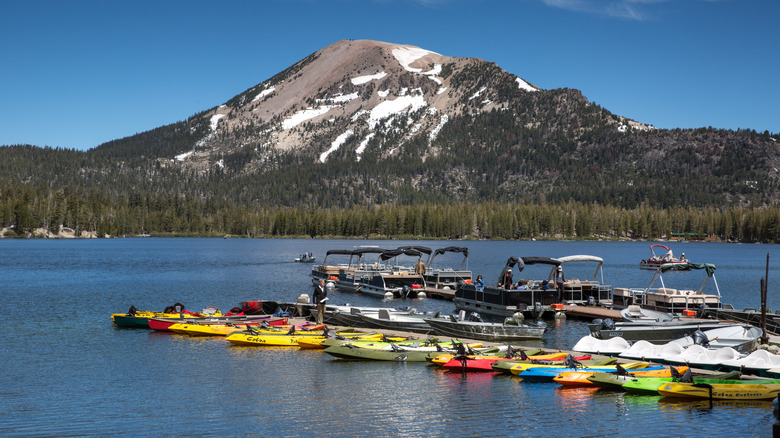 Colorful kayaks and pontoons dock at Lake Mary in Mammoth Lakes, California.