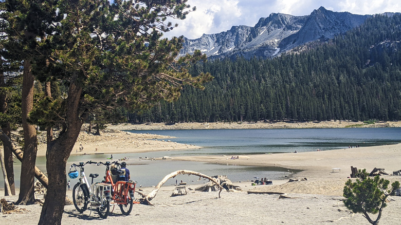 Two bikes are parked up beside a lake in Mammoth, CA