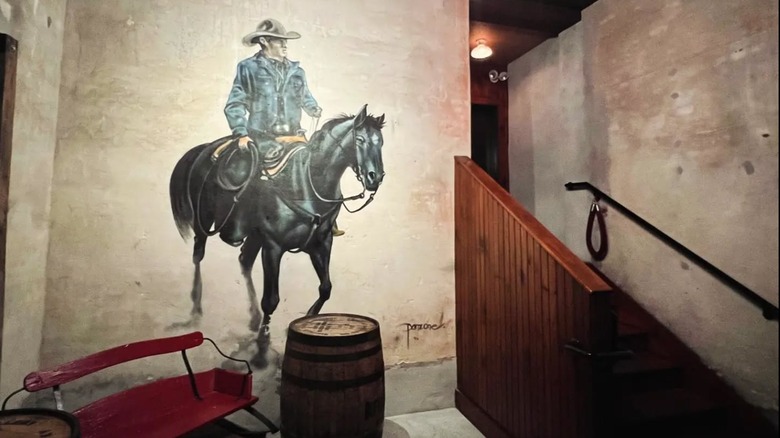 Mural of a cowboy on a horse outside a tavern in Pennsylvania.