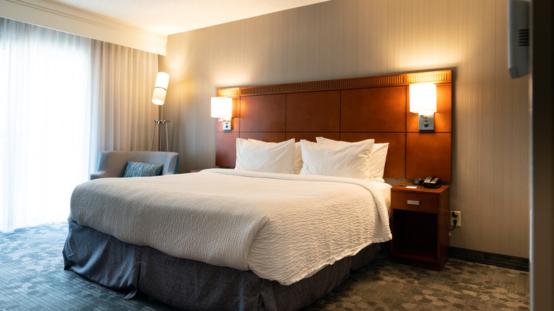 Interior of a hotel room with a king-size bed