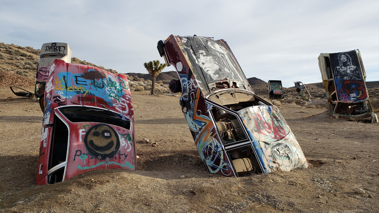 Cars sticking out of the sand at the International Car Forest in Goldfield, Nevada