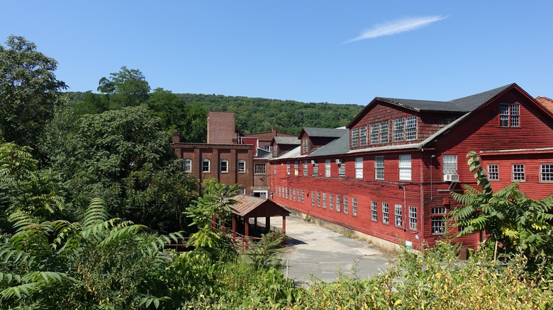 An old mill in surrounded by trees in Connecticut