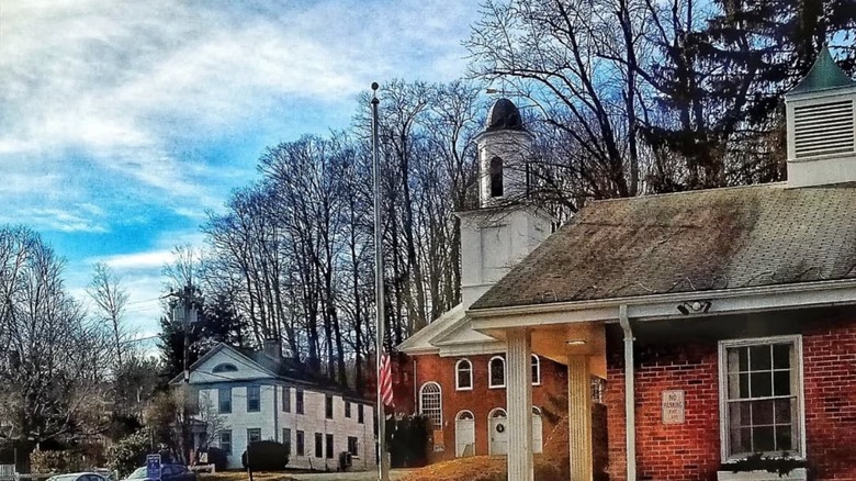 Old brick buildings surrounded by trees in New Hartford, Connecticut