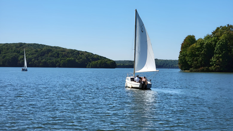 A sailboat cuts across Lake Arthur on a sunny day in Pennsylvania