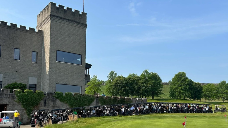 Medieval-style tower above golf course green