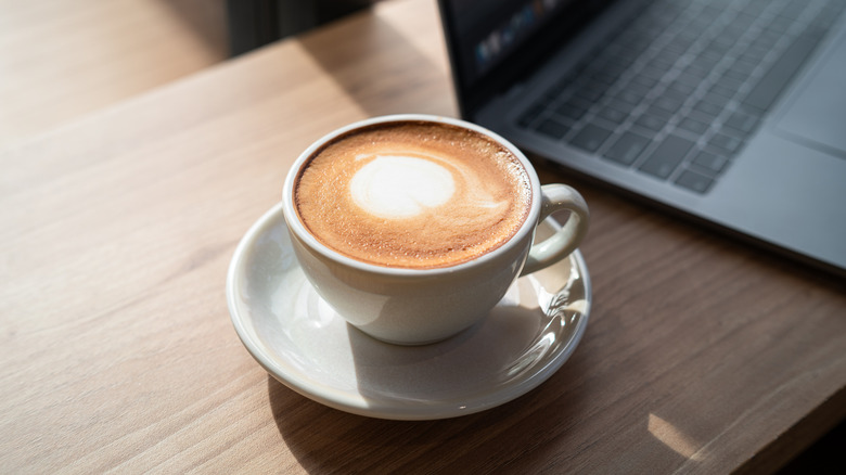 Coffee with latte resting on a table