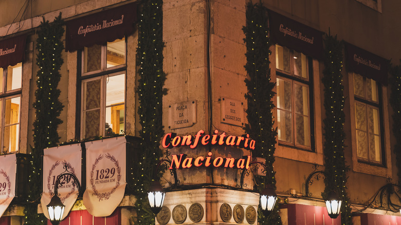 The sign for Confeitaria Nacional on a street corner in Lisbon