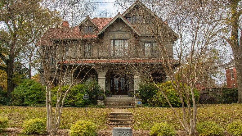 Old gray house with brick roof in Quapaw Quarter