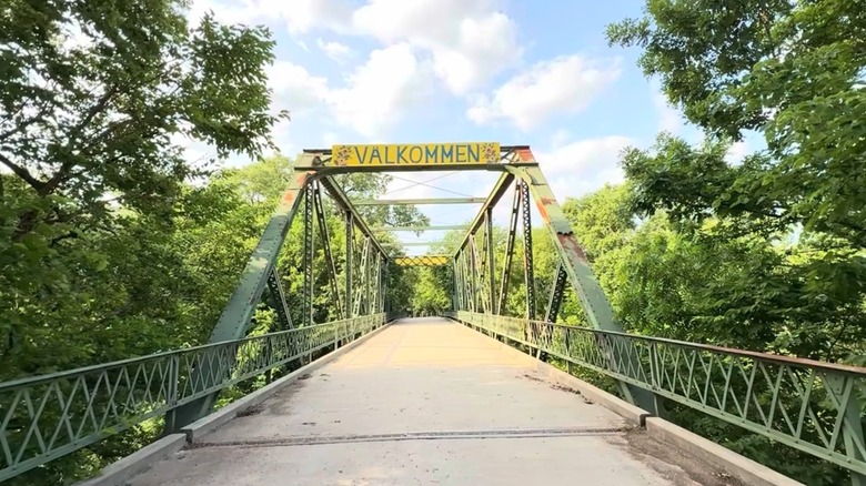 Steel bridge with Swedish welcome sign
